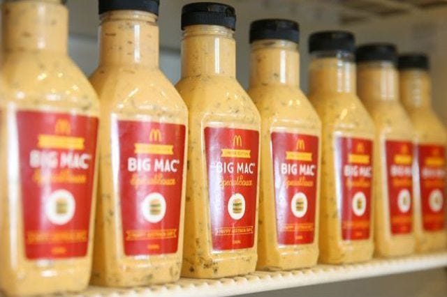 Product, Liquid, Yellow, Bottle, Bottle cap, Condiment, Beige, Service, Ingredient, Packaging and labeling, 