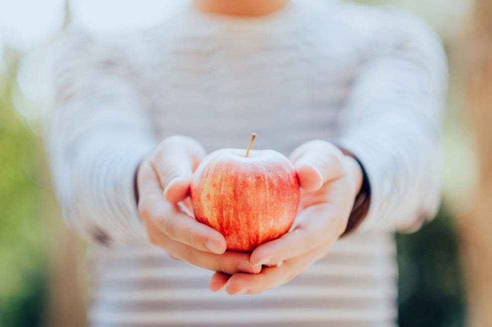 Finger, Skin, Fruit, Natural foods, Peach, Produce, People in nature, Apple, Local food, Love, 