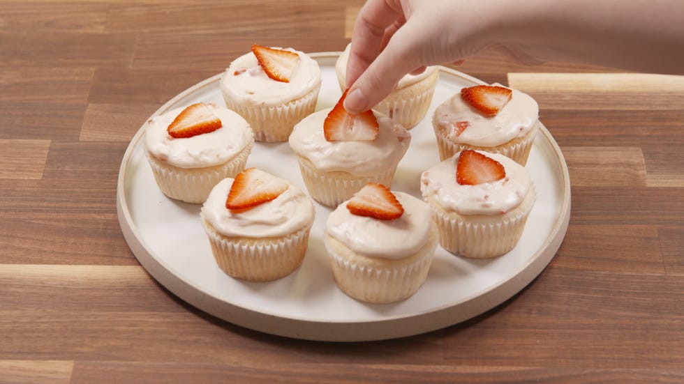 Strawberry Mimosa Cupcakes Being Garnished