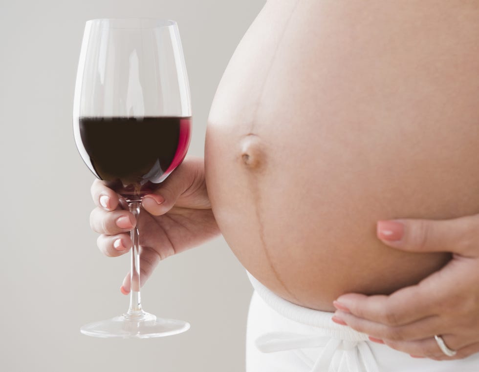 Finger, Stemware, Glass, Drinkware, Wine glass, Drink, Skin, Fluid, Barware, Dessert wine, 