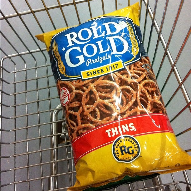 Yellow, Food, Logo, Metal, Mesh, Snack, Symbol, Junk food, Staple food, Label, 