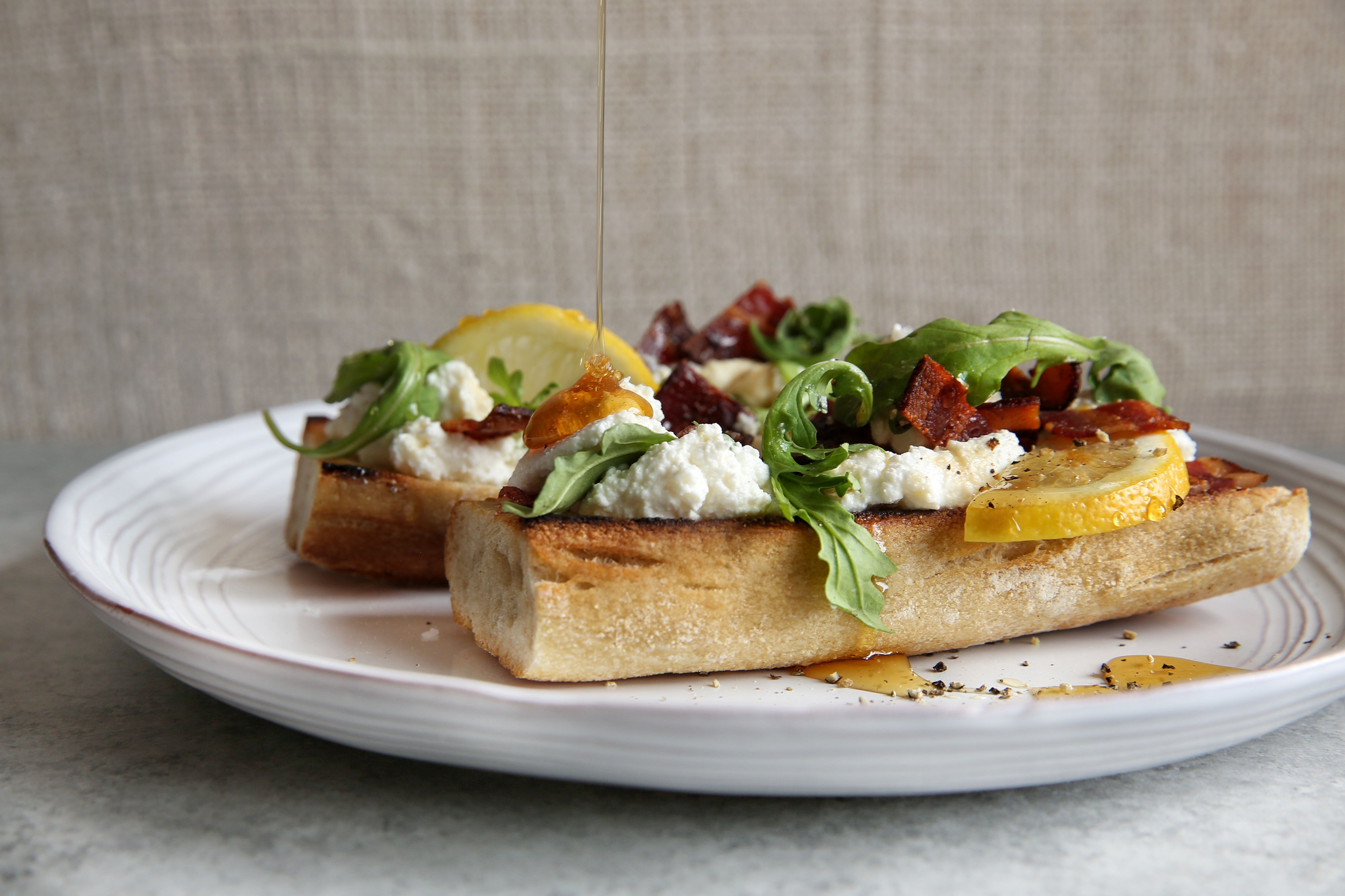 Best Bacon Tartines With Ricotta Honey And Arugula Recipe Delish Com