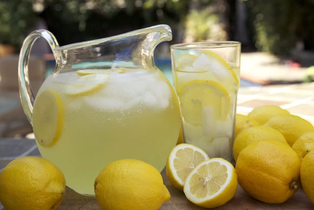 pitcher and glass of lemonade outside