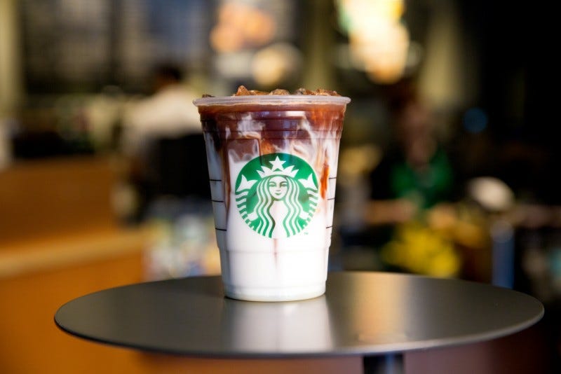 Drinkware, Logo, Fast food, Cup, Wood stain, Cup, Drinking straw, Non-alcoholic beverage, Plywood, 