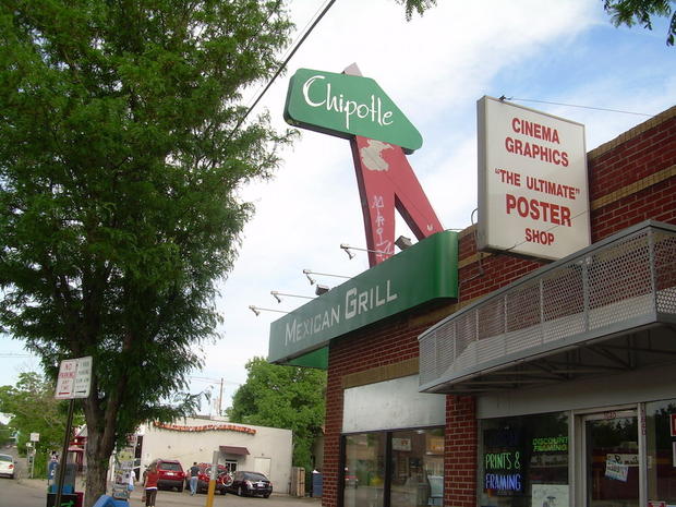 Town, Signage, Sign, Commercial building, Pole, Sidewalk, Door, Street sign, Advertising, Retail, 