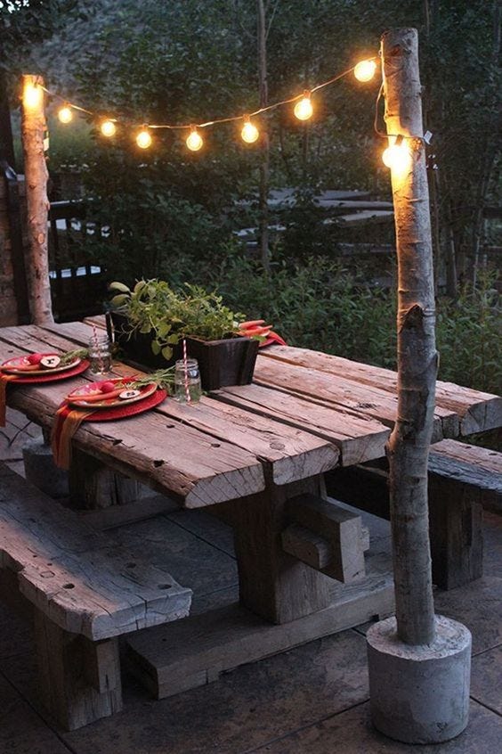 Lighting, Outdoor table, Outdoor furniture, Hardwood, Concrete, Lumber, Houseplant, Outdoor structure, Backyard, Patio, 