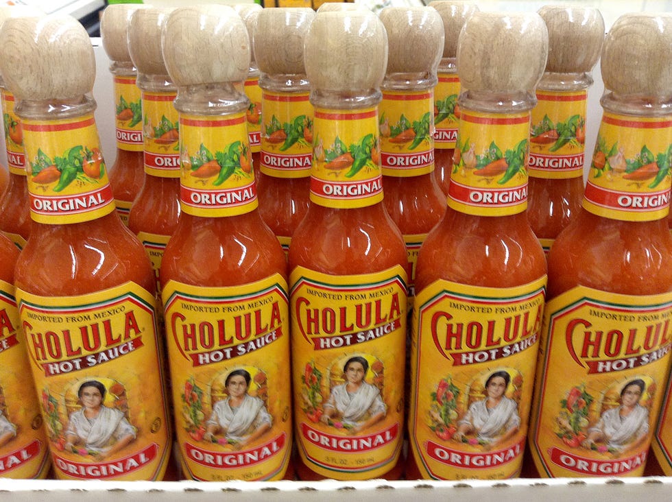 bottle, orange, condiment, sauces, ingredient, logo, bottle cap, plastic bottle, food storage, packaging and labeling,