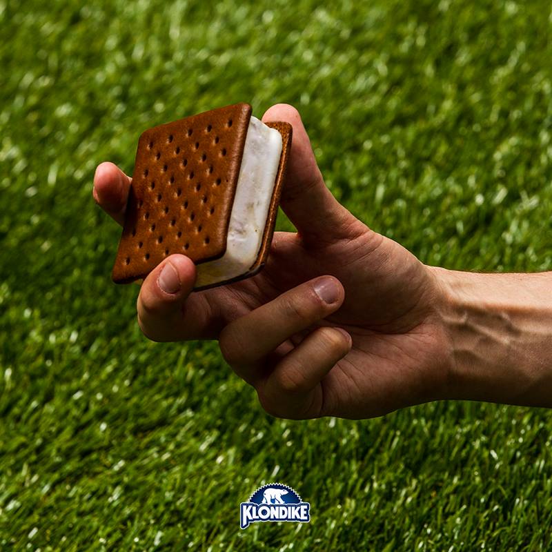 People in nature, Thumb, Tan, Nail, Chocolate, Dessert, Snack, Chocolate bar, Wafer, Waffle, 