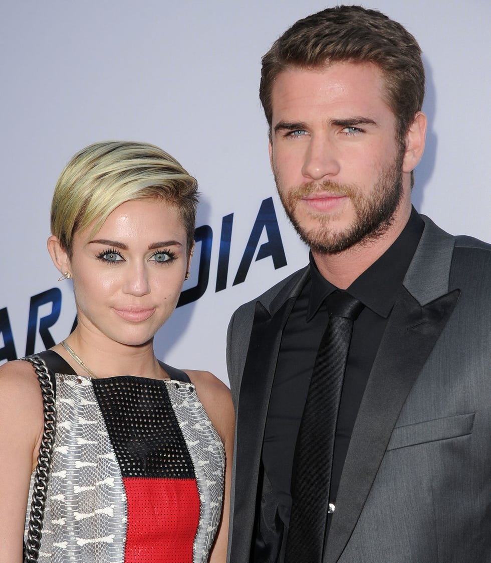 LOS ANGELES, CA - AUGUST 08:  MIley Cyrus and Liam Hemsworth arrives at the "Paranoia" - Los Angeles Premiere at DGA Theater on August 8, 2013 in Los Angeles, California.  (Photo by Steve Granitz/WireImage)