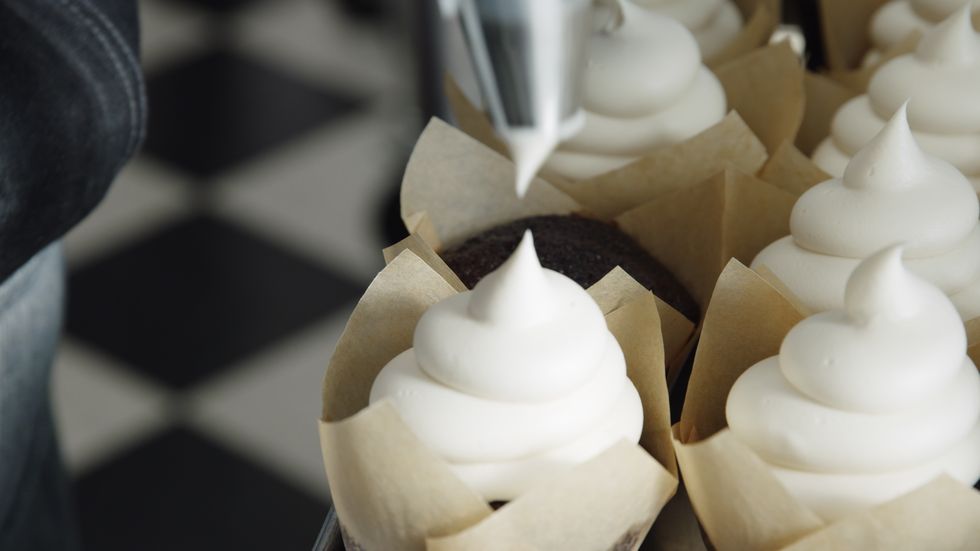Frosting cupcakes at Silos Baking Co.