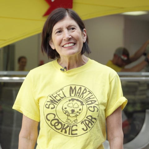 Yellow, Sleeve, Shoulder, Logo, Chest, Active shirt, Tooth, Laugh, Top, Throat, 