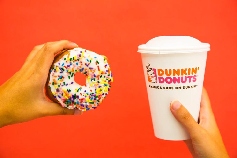Finger, Food, Doughnut, Drinkware, Sweetness, Dessert, Logo, Sprinkles, Junk food, Fast food, 