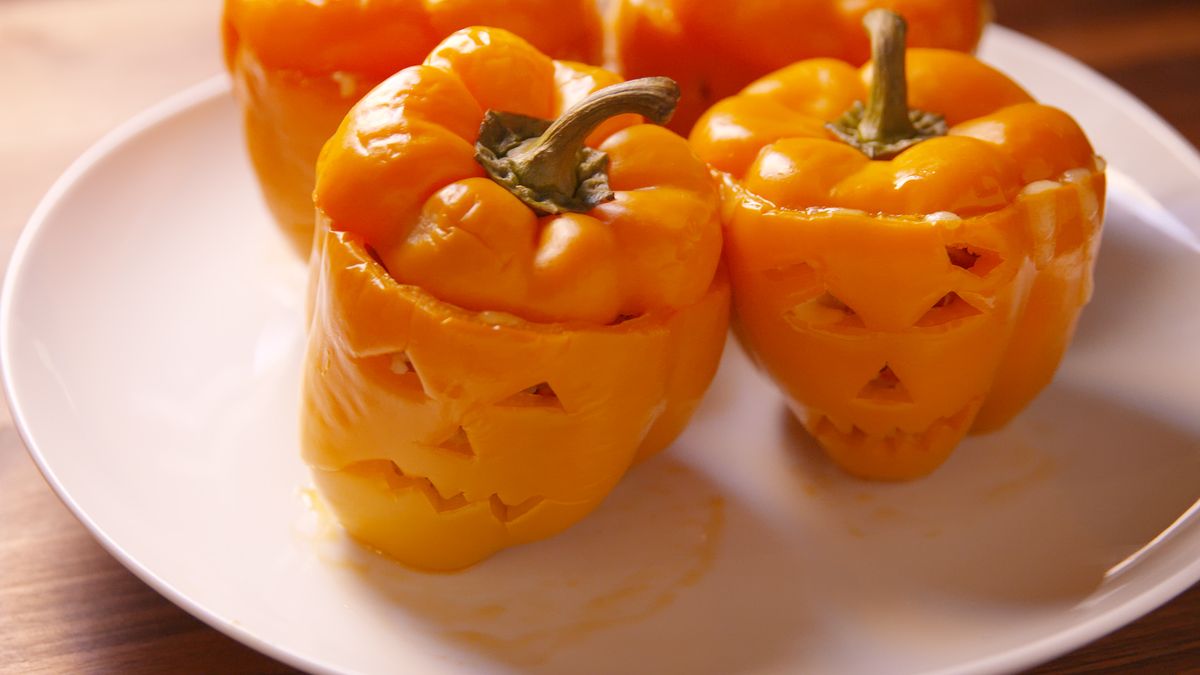 preview for Skip The Pumpkins And Carve Jack-O'-Lantern Stuffed Peppers Instead!