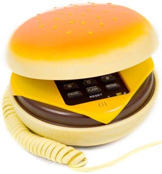 Yellow, Orange, Ingredient, Bun, Plastic, Egg cup, Macaroon, Finger food, Small appliance, Kitchen appliance, 