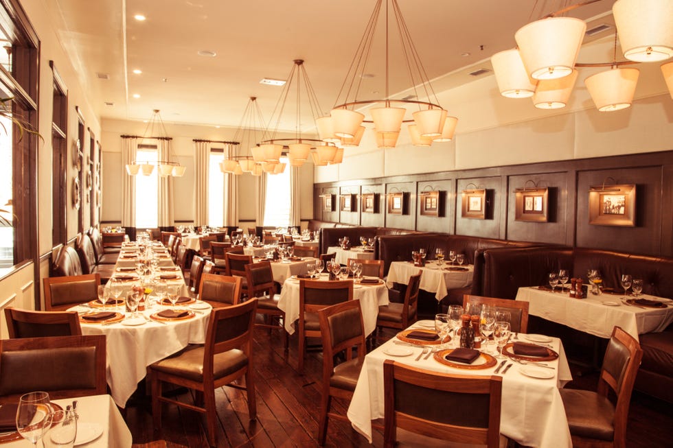 Lighting, Tablecloth, Interior design, Furniture, Light fixture, Restaurant, Ceiling fixture, Table, Ceiling, Interior design, 