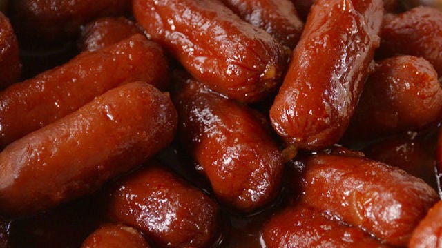 Video player poster image preview for Slow-Cooker Bourbon Smokies Put Pigs in a Blanket to Shame.