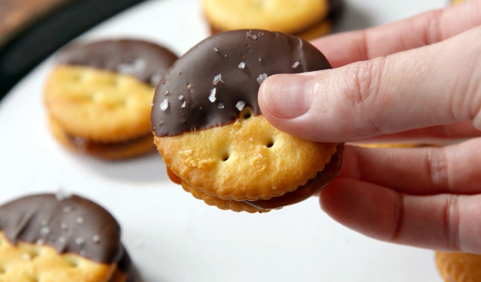 Human, Finger, Food, Finger food, Yellow, Dessert, Sweetness, Cuisine, Baked goods, Amber, 