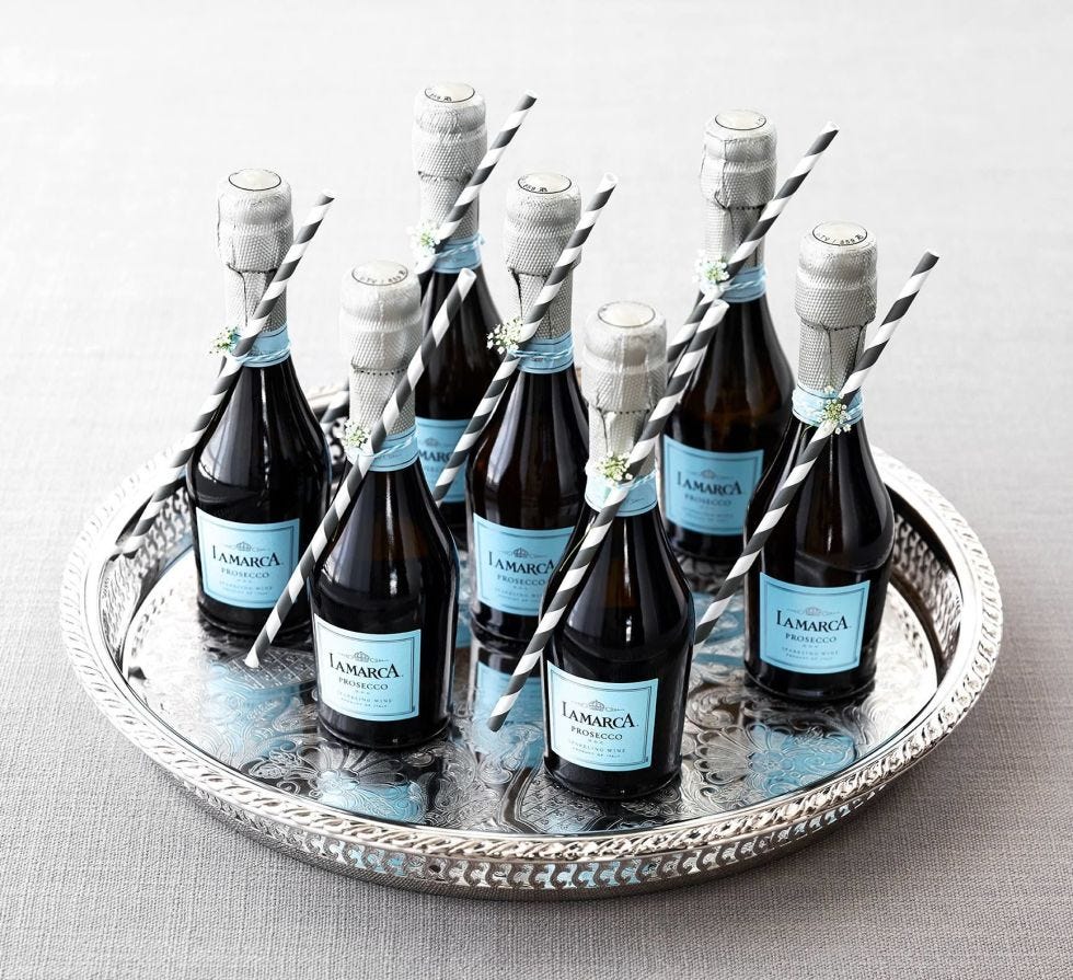 Glass bottle, Bottle, Liquid, Glass, Bottle cap, Alcohol, Drinkware, Drink, Alcoholic beverage, Teal, 
