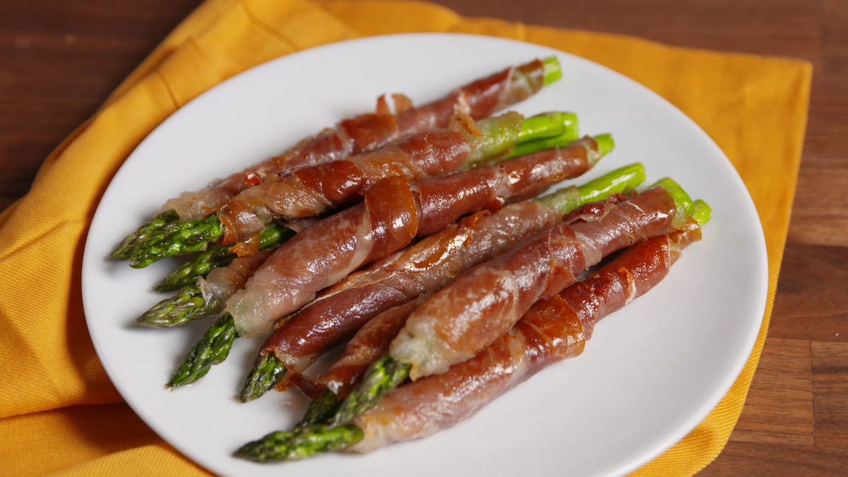 Video player poster image preview for Prosciutto-Wrapped Asparagus is the Appetizer that Always Sleighs.