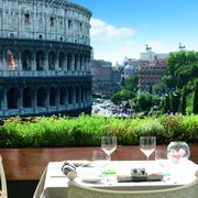 Tablecloth, Table, Furniture, Outdoor furniture, Outdoor table, Linens, Ancient rome, Wine glass, Stemware, Amphitheatre, 