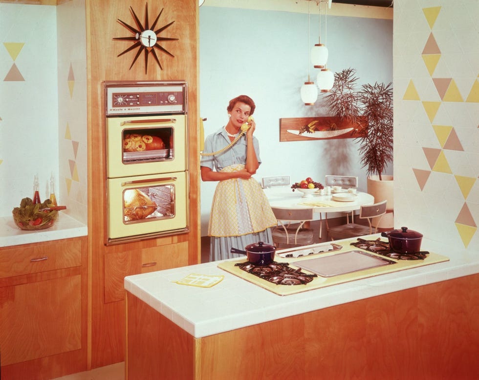 Room, Interior design, Interior design, Cook, Countertop, Flowerpot, Kitchen, Wallpaper, Houseplant, Cabinetry, 