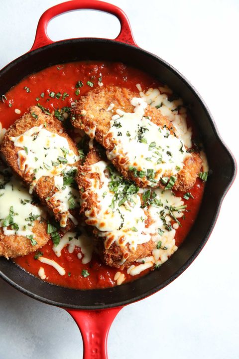 chicken parm in a red cast iron skillet
