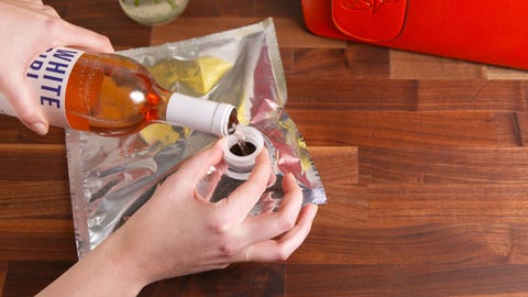 purse that holds a bottle of wine