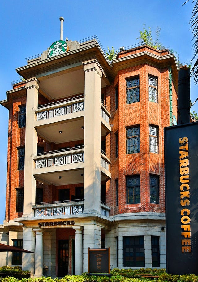 Facade, Building, Real estate, Landmark, Apartment, Commercial building, Signage, Door, Banner, Condominium, 