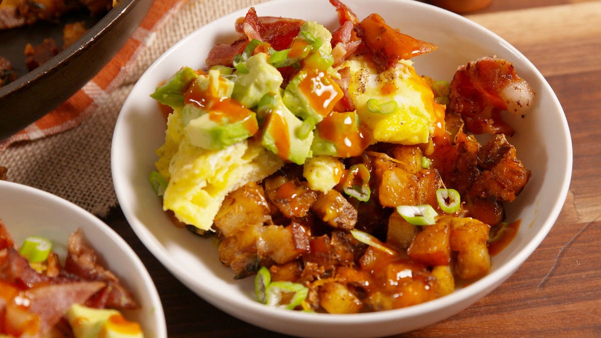 Video player poster image preview for These Cheese-Smothered Potatoes are the Best Part of our Cowboy Breakfast Bowls.