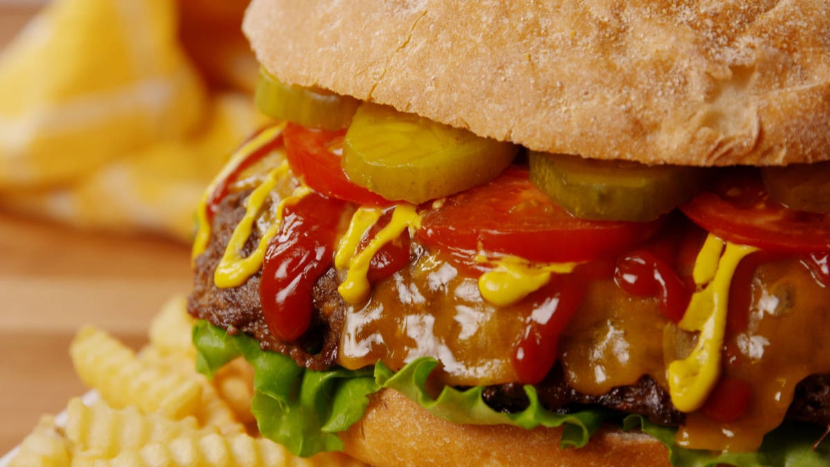 Video player poster image preview for This Giant Party Cheeseburger Is So Much Better Than Grilling 12 Burgers!