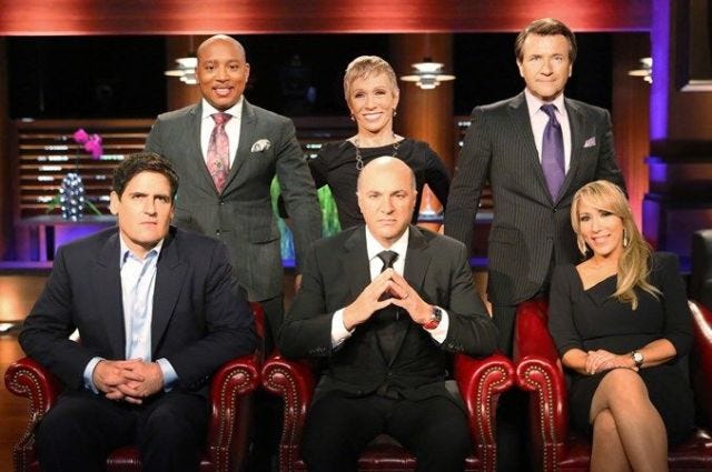 https://hips.hearstapps.com/del.h-cdn.co/assets/17/12/640x425/gallery-1490458778-shark-tank-cast.jpg?resize=640:*