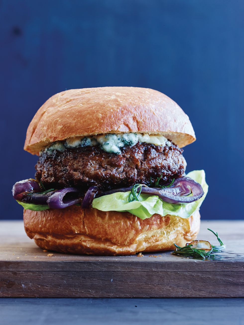 Blue Cheese Burgers with Caramelized Onions and Crispy Rosemary Vertical