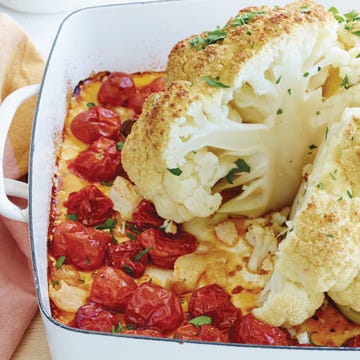 whole roasted cauliflower, tomatoes and garlic horizontal
