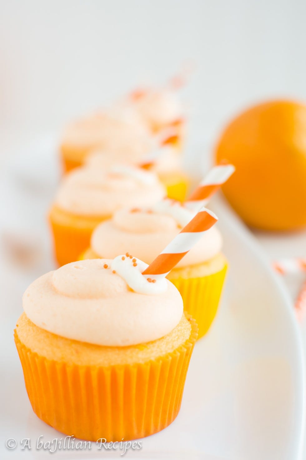 Food, Orange, Icing, Baking cup, Yellow, Cupcake, Dessert, Buttercream, Cake, Cuisine, 