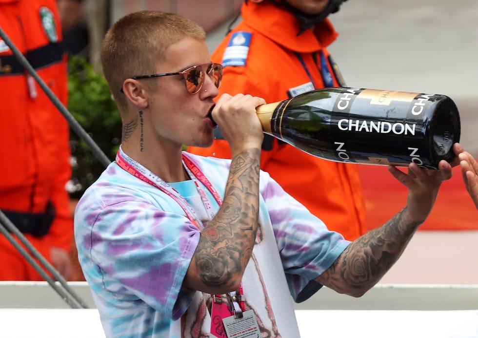 Eyewear, Glasses, Vision care, Hand, Sunglasses, Goggles, Beverage can, Aluminum can, Baseball cap, Drinking, 