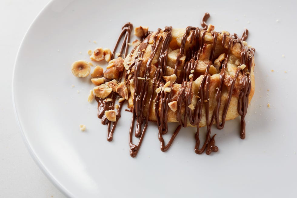 Seasonal fruit crostata, an open-faced pie topped with Nutella and hazelnuts