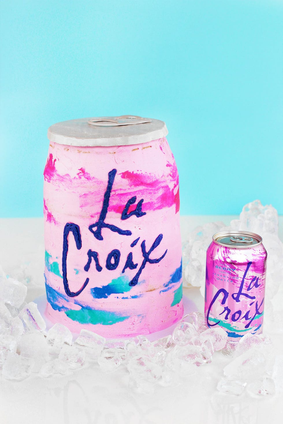 Beverage can, Product, Pink, Soft drink, Font, Drink, Non-alcoholic beverage, Carbonated soft drinks, Home accessories, Paper, 
