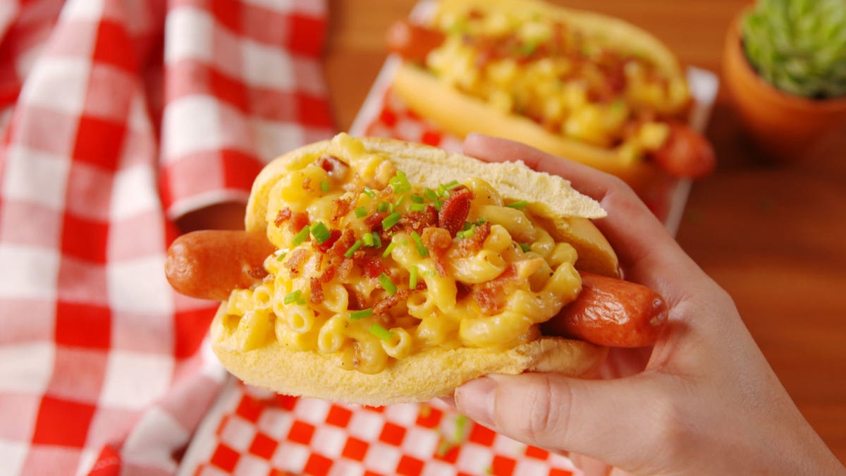Video player poster image preview for Mac & Cheese Hot Dogs Are How Summer Does Comfort Food