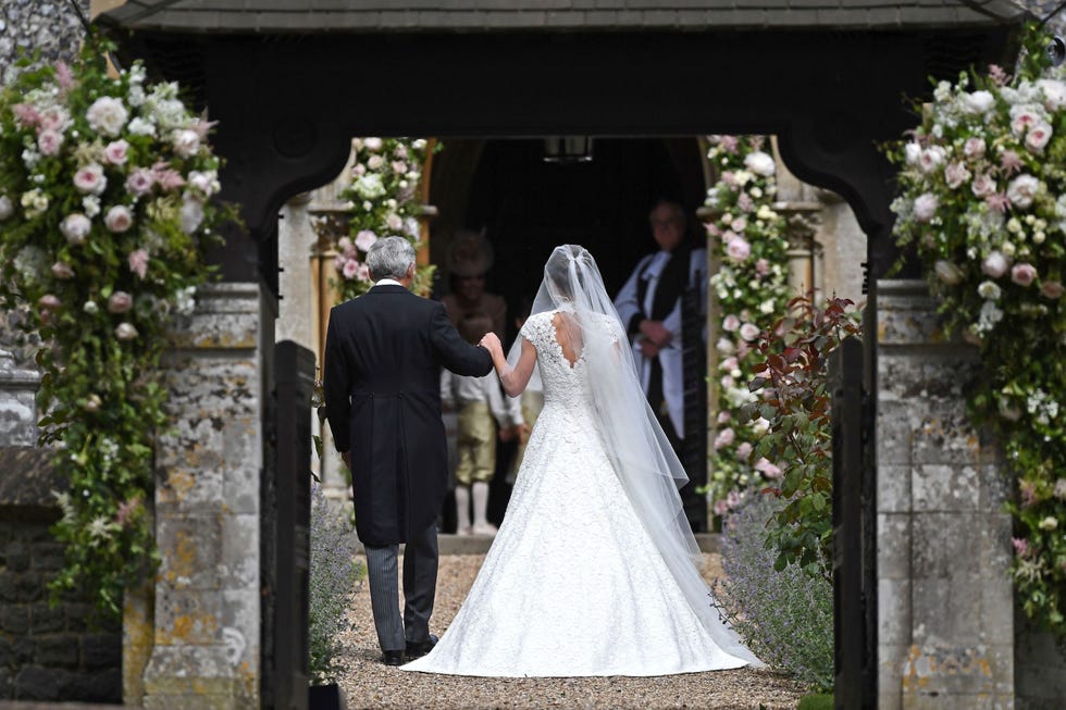 Clothing, Bridal veil, Dress, Bridal clothing, Trousers, Petal, Coat, Veil, Suit, Photograph, 