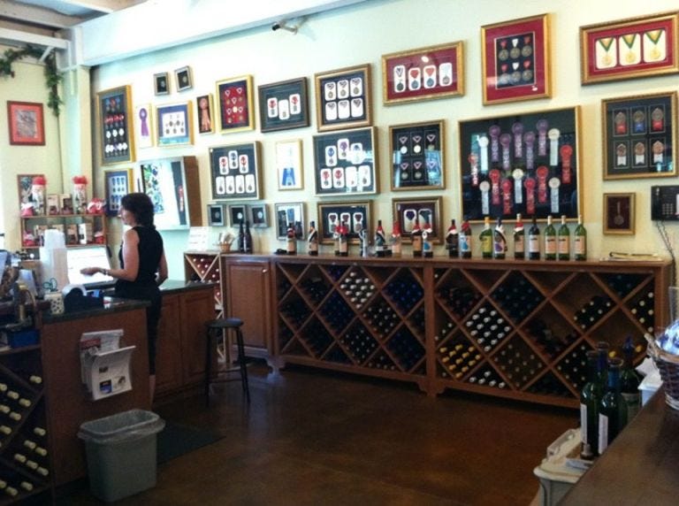 Picture frame, Collection, Interior design, Barware, Distilled beverage, Bottle, Cabinetry, Box, Shelf, 
