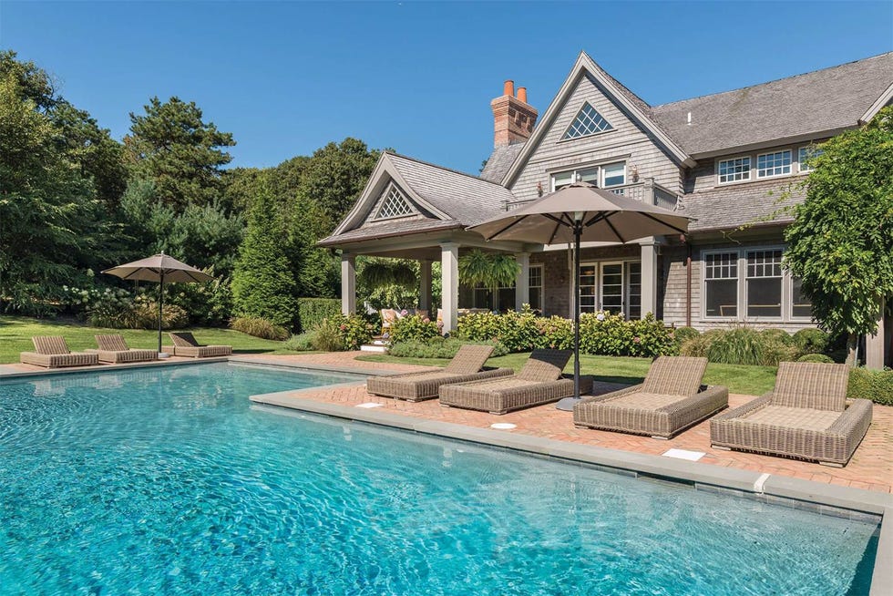 Swimming pool, Property, Real estate, House, Resort, Residential area, Home, Roof, Azure, Villa, 