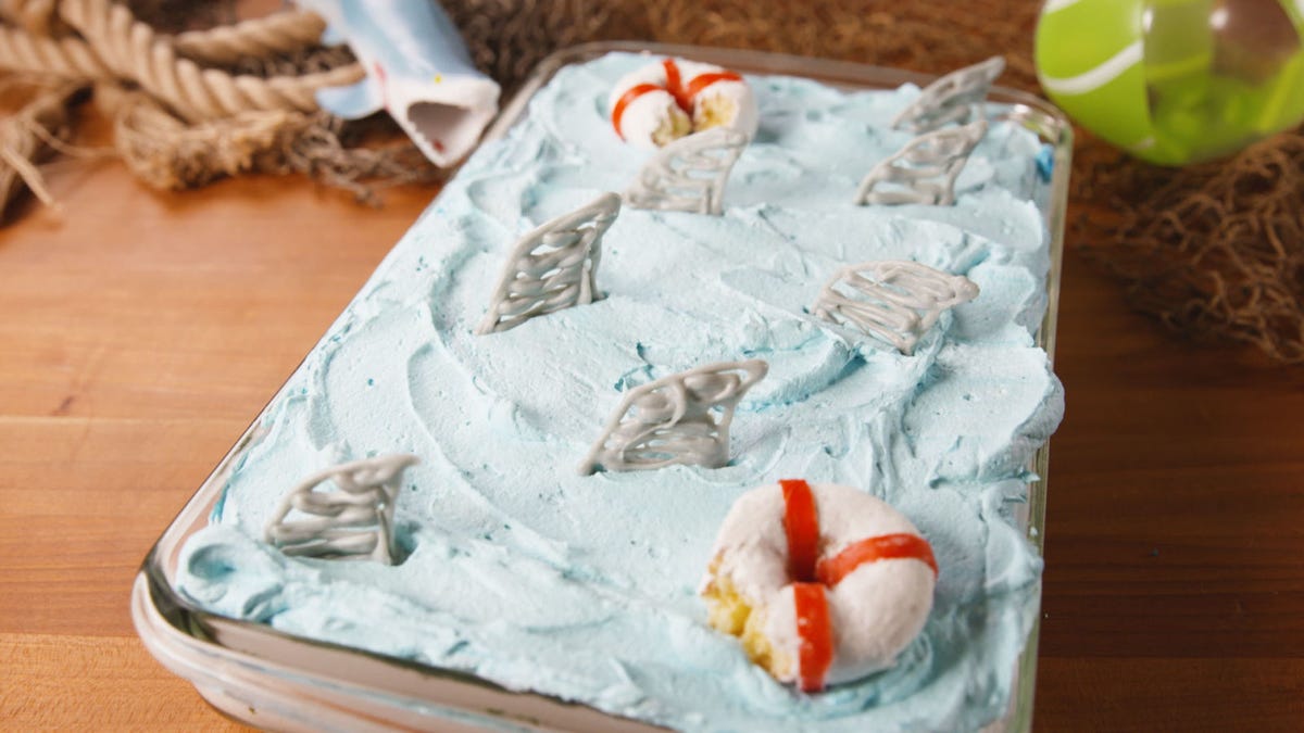 preview for You'll Never Guess What's Below The Surface Of This Shark Attack Poke Cake