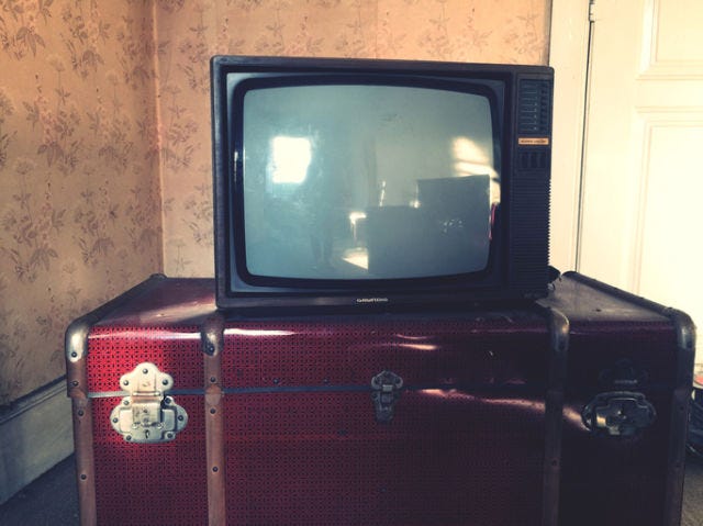 <p>Another outdated feature of my West Virginia room was its 12" box TV. While I wasn't expecting a 26" HDTV, I wondered why the owners bothered to provide one at all? The heating system was also a throwback. I was looking for the advertised "electric fireplace" and spent the first night without heat, thinking there was a misprint on the brochure. By the second night, I figured out that I needed to crank up the temperature on the pellet stove in the corner.</p>
