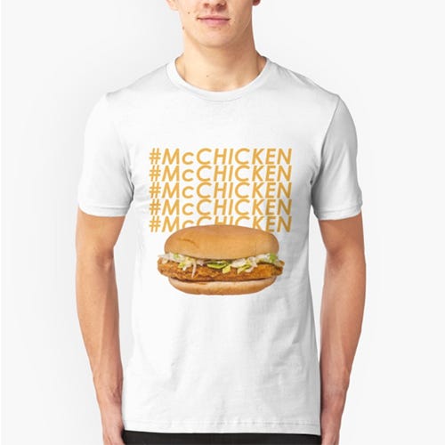 <p><strong data-redactor-tag="strong" data-verified="redactor"><em data-redactor-tag="em" data-verified="redactor">$20</em></strong> <a href="https://www.redbubble.com/people/ben-wut/works/22977920-mcchicken?grid_pos=25&amp;p=t-shirt&amp;rbs=df109fc0-8ceb-44dd-b473-24f1f5409a29&amp;ref=shop_grid" target="_blank" class="slide-buy--button" data-tracking-id="recirc-text-link">BUY NOW</a> </p><p>If you have strong feelings about the McChicken, here's an easy way to tell everyone about it.&nbsp;</p>