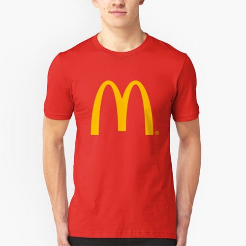 <p><strong data-redactor-tag="strong" data-verified="redactor"><em data-redactor-tag="em" data-verified="redactor">$21</em></strong>&nbsp;<a href="https://www.redbubble.com/people/davidb393/works/27241185-mcdonalds?p=t-shirt&amp;style=mens&amp;body_color=red&amp;print_location=front" target="_blank" class="slide-buy--button" data-tracking-id="recirc-text-link">BUY NOW</a></p><p>This tee is solely reserved for the McD's purists of the world. The McMinimalists, if you will.&nbsp;</p>