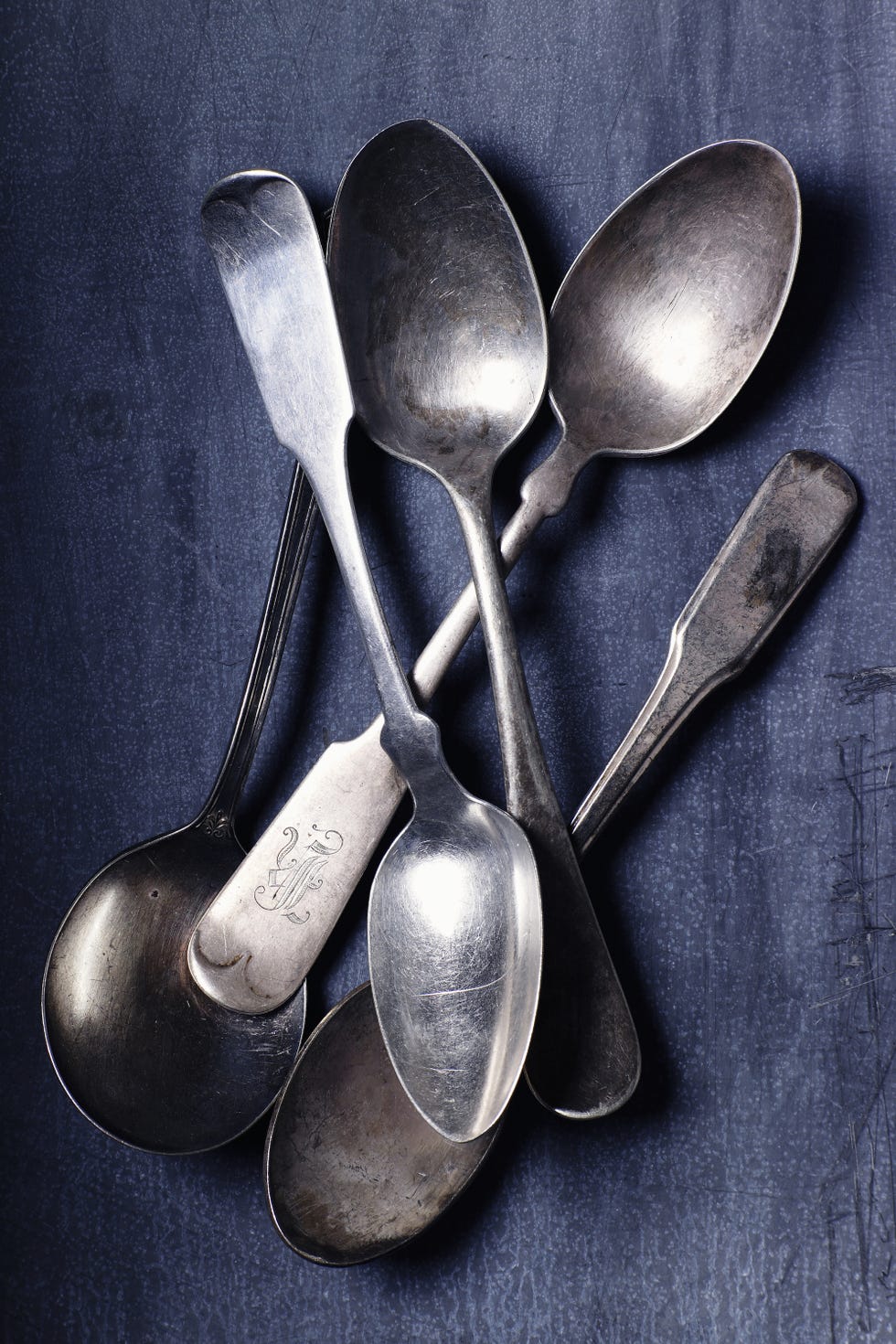 Cutlery, Kitchen utensil, Spoon, Metal, Silver, Household silver, Natural material, Steel, Still life photography, 