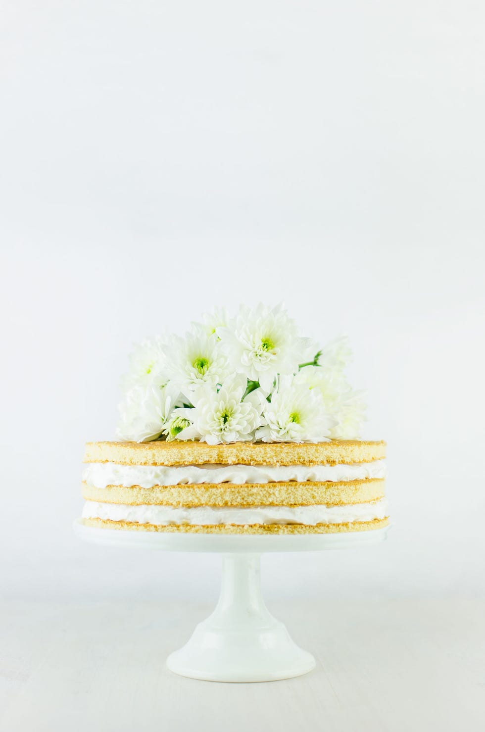 Buttercream, Cake, Cake stand, Icing, Cake decorating, Yellow, Sugar cake, Food, Dessert, Flower, 