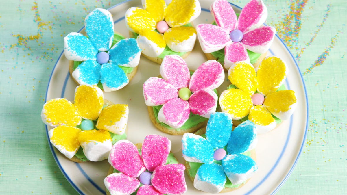Video player poster image preview for How To Turn Sugar Cookies Into Adorable Marshmallow Flowers