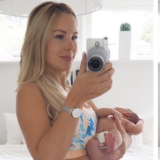 Uhrdin posing with her newborn baby