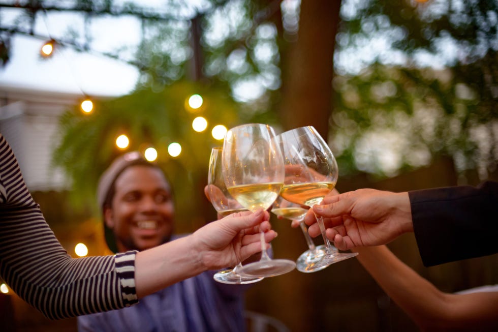Drink, Hand, Glass, Distilled beverage, Stemware, Leisure, Wine glass, Alcohol, Drinkware, Champagne stemware, 